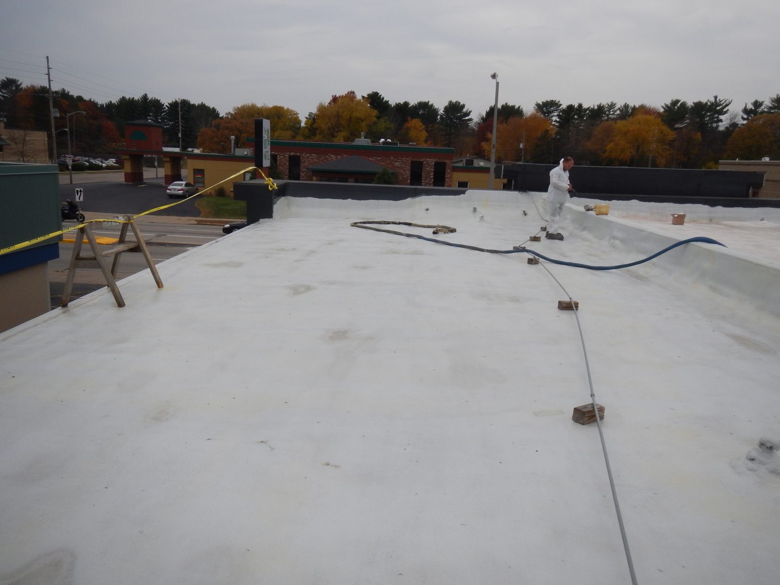 Large commercial warehouse metal roof waterproofed with polyurea