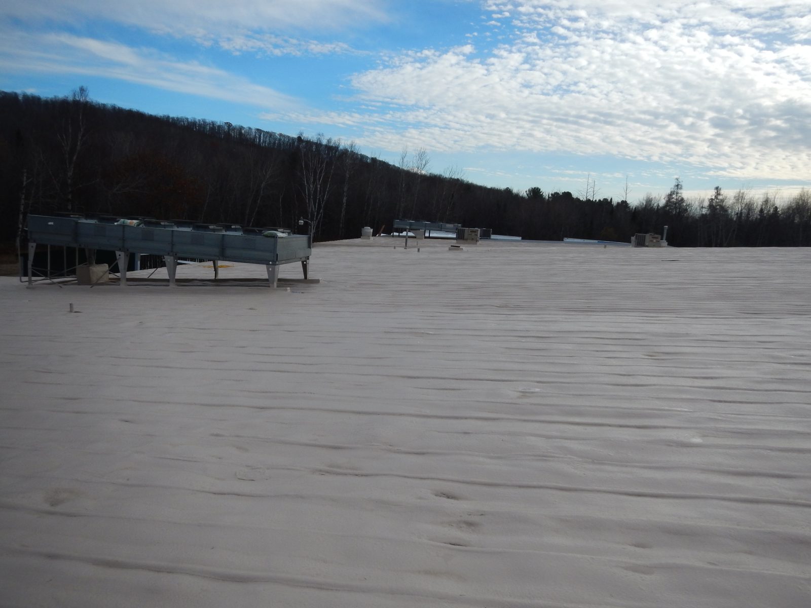 Industrial metal roof waterproofing in progress