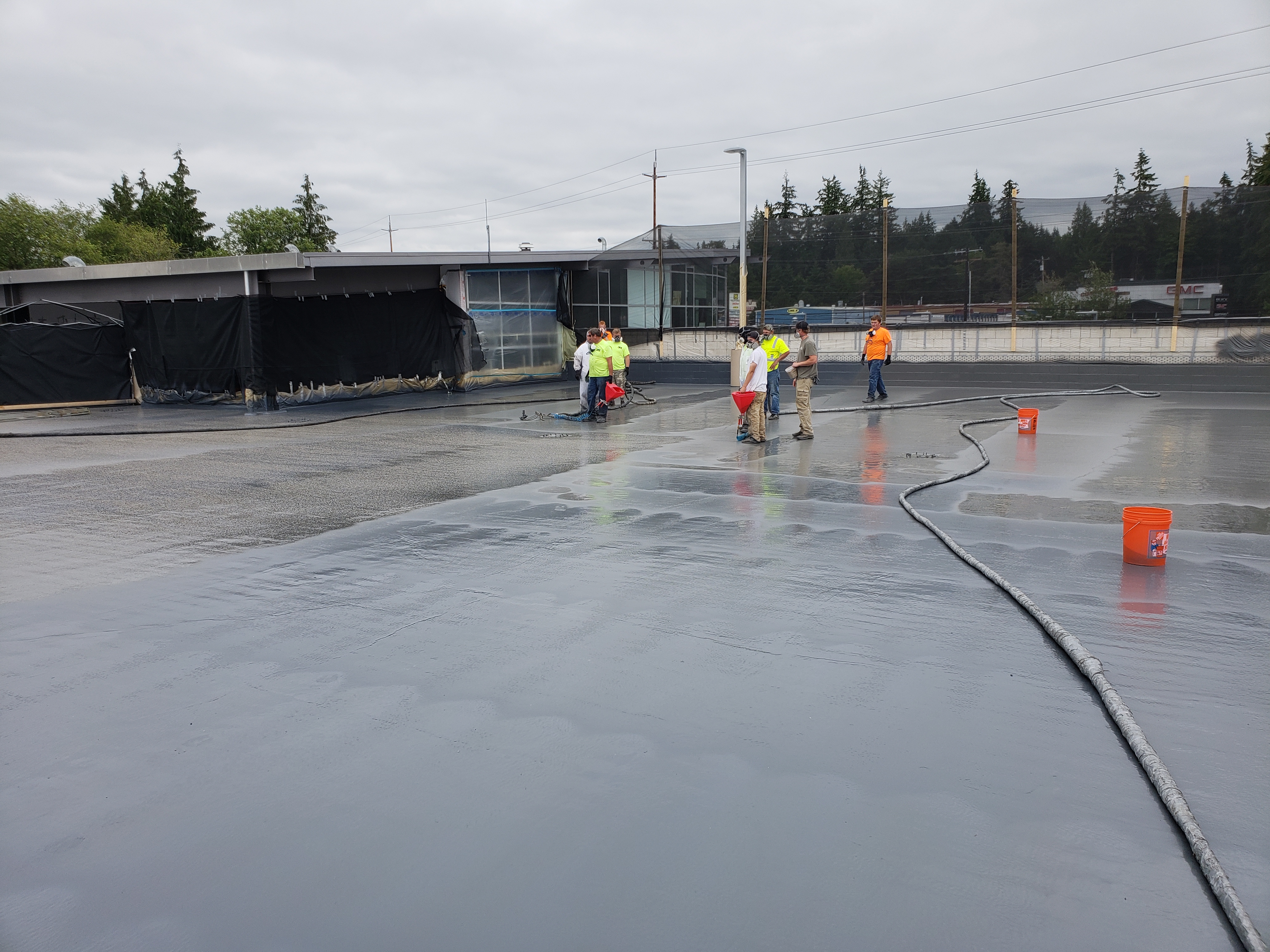 Roof curb and penetration detailed with sprayed polyurea membrane